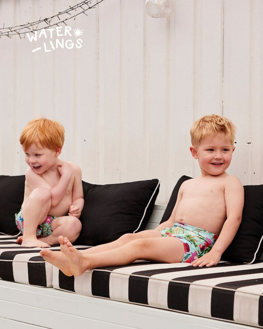 Children ready for pool time in swim nappies