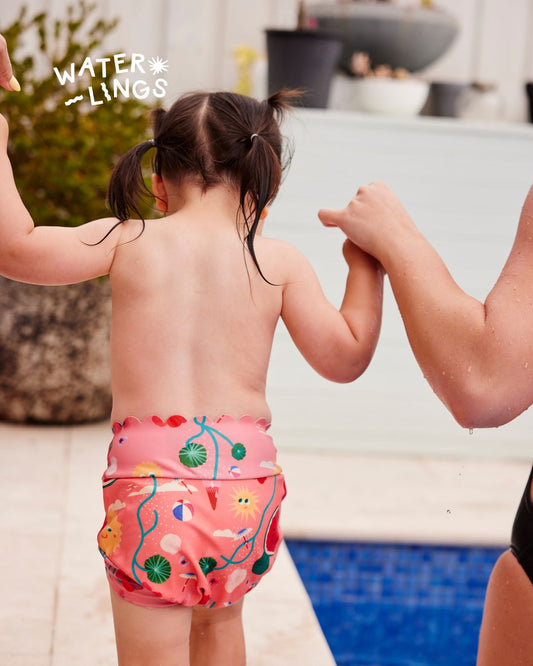 Child in a reusable swim nappy